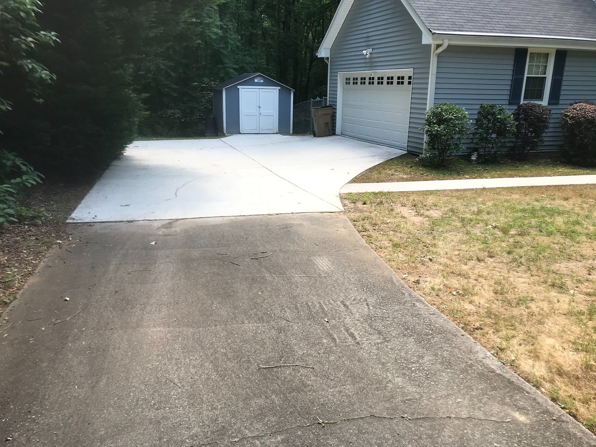 Before and after driveway pressure washing project.