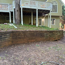 Boosting-Curb-Appeal-for-Faster-Sales-Repeat-Investor-Trusts-CK1-with-Wood-Retaining-Wall-Cleaning 1